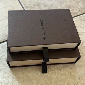 Two authentic Louis Vuitton gift/storage boxes.